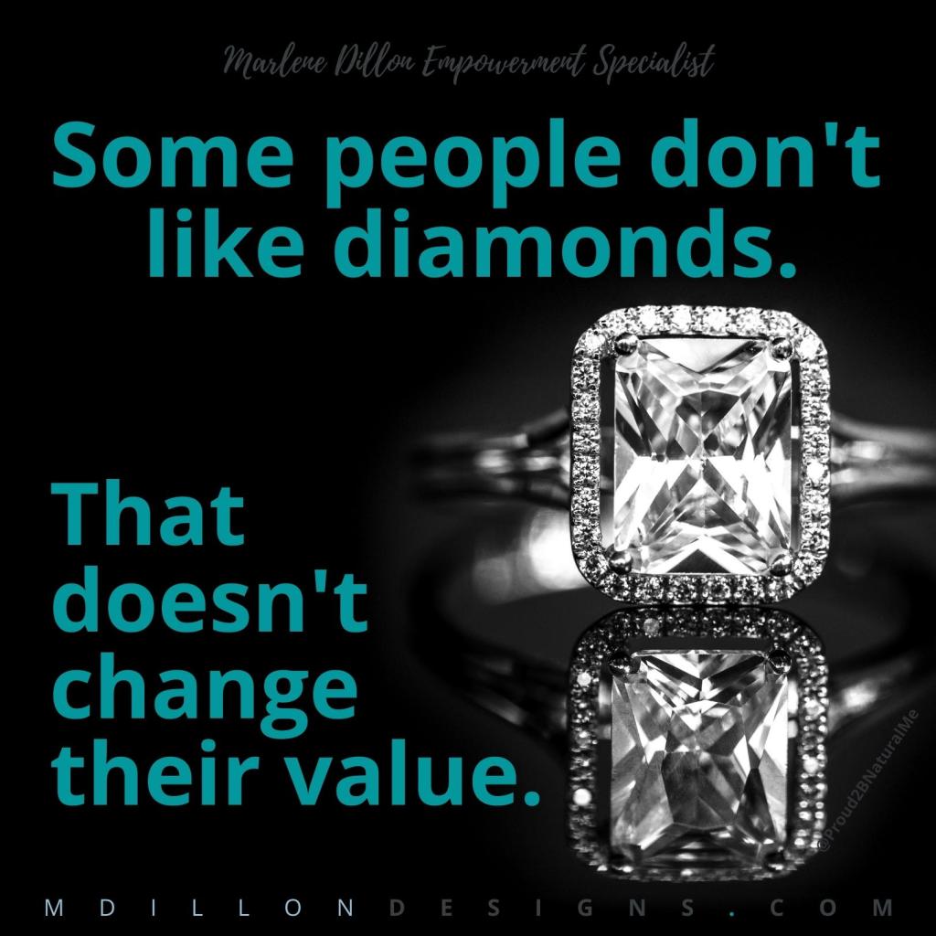 Photo of a diamond ring with black background. Text in cyan states "Marlene Dillon Empowerment Specialist  Some people don't like diamonds. That doesn't change their value.  mdillondesigns.com @Proud2BNaturalMe