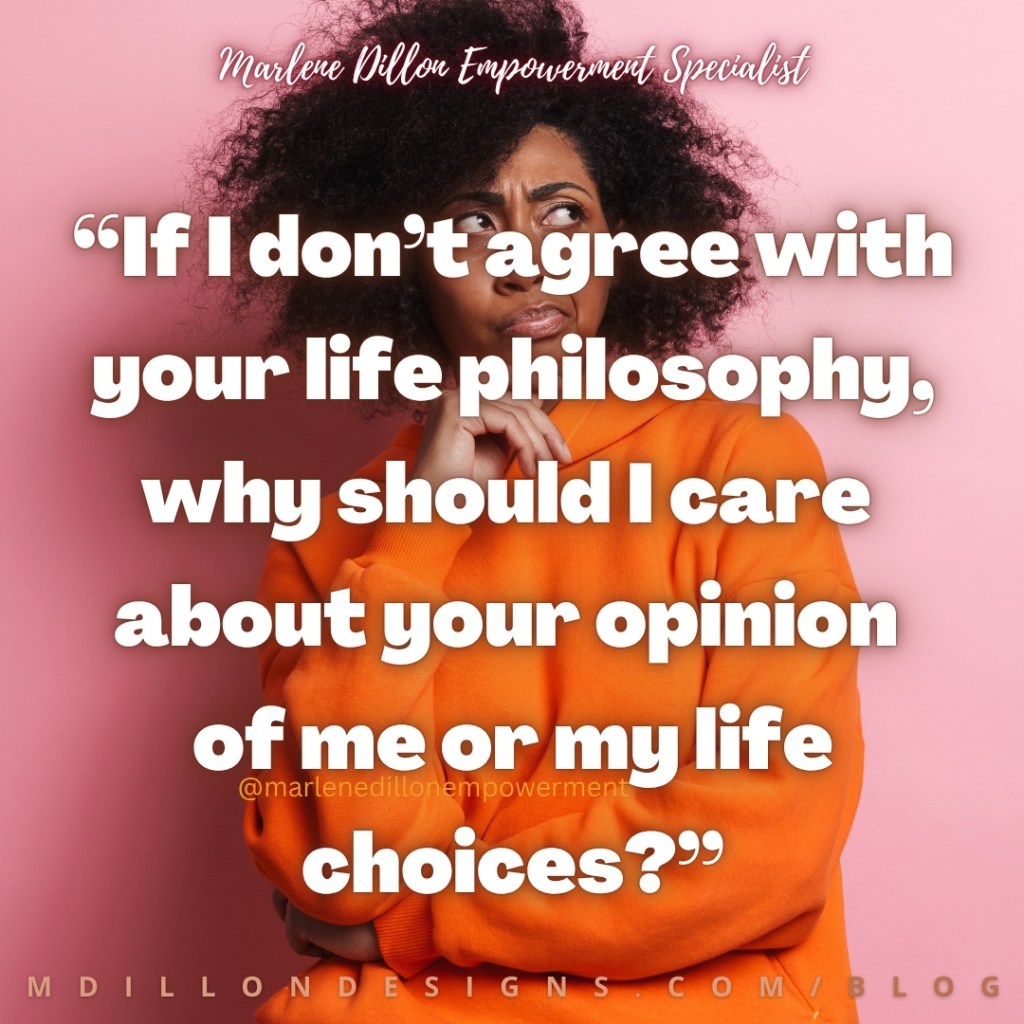 Marlene Dillon Empowerment Specialist’s quote: “If I don’t agree with your life philosophy, why should I care about your opinion of me or my life choices?” appears in large, bold white lettering with a dark drop shadow over a woman with natural hair wearing a bright orange sweater, her arms crossed and one hand under her chin as she looks to the side against a pink background. “Marlene Dillon Empowerment Specialist” appears in white script at the top, @marlenedillonempowerment appears across the lower center, and the footer displays “mdillondesigns.com/blog”